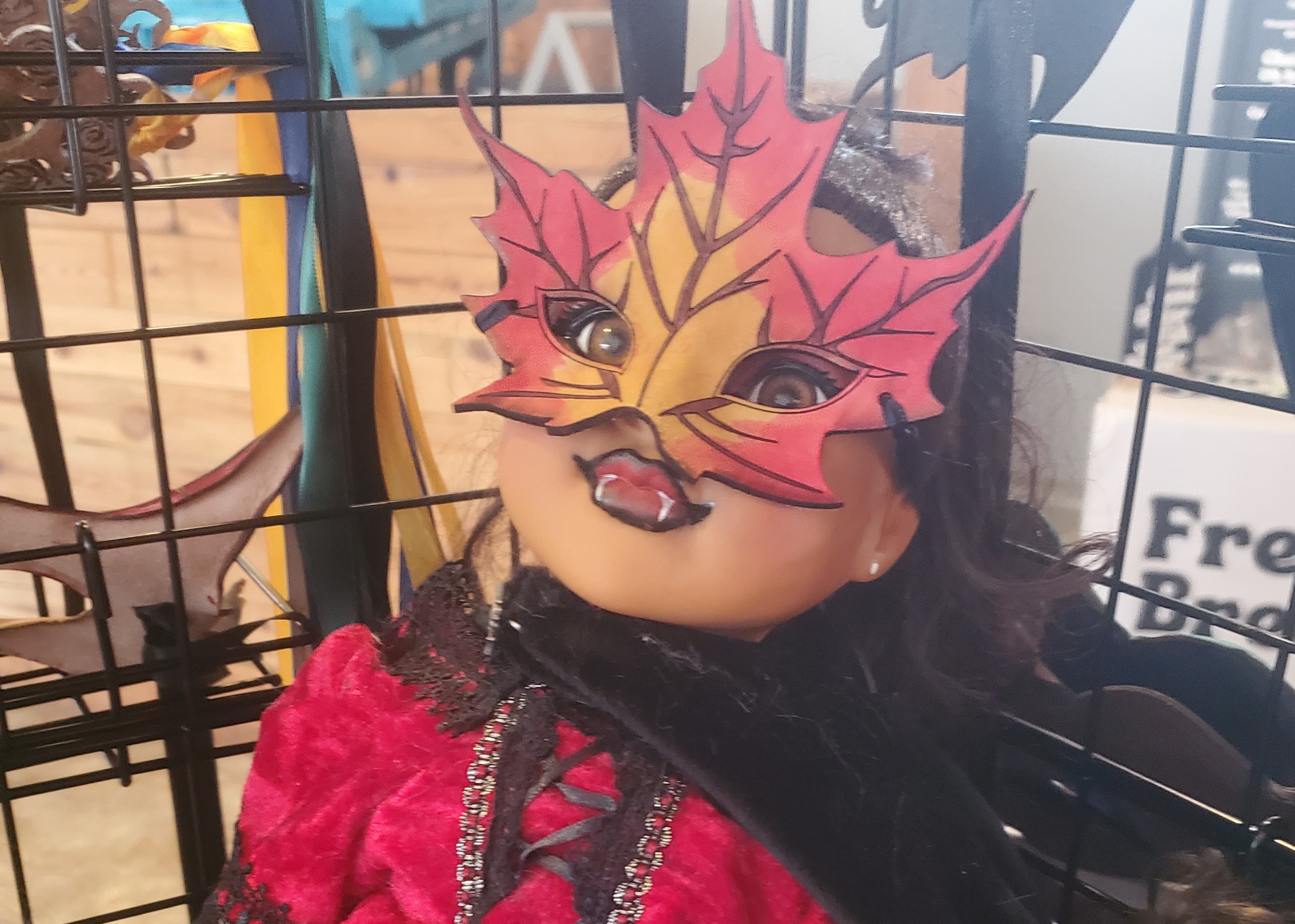 Picture of a Vampire doll in a leaf mask.