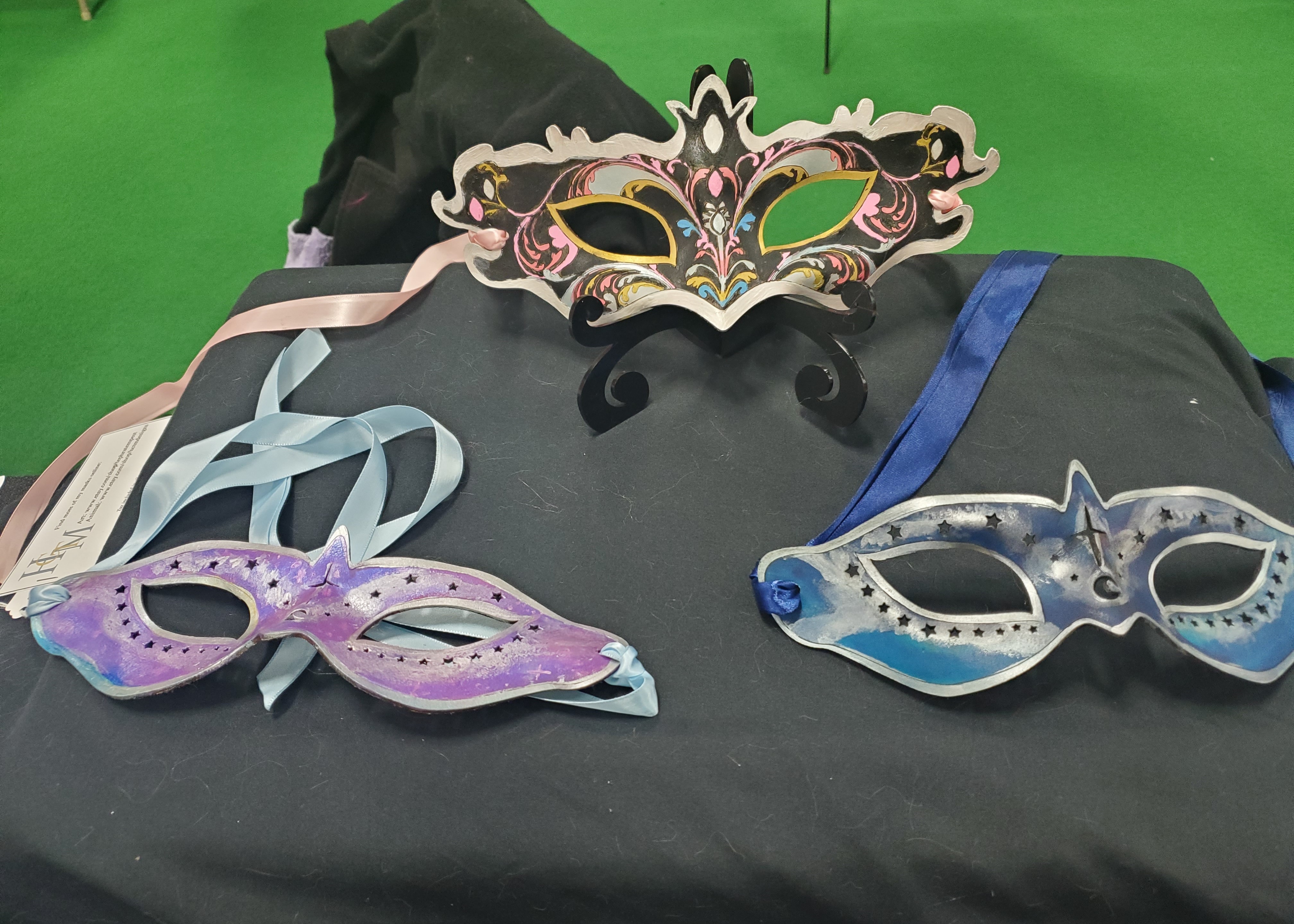 Picture of Leather Masquerade masks on a table display.