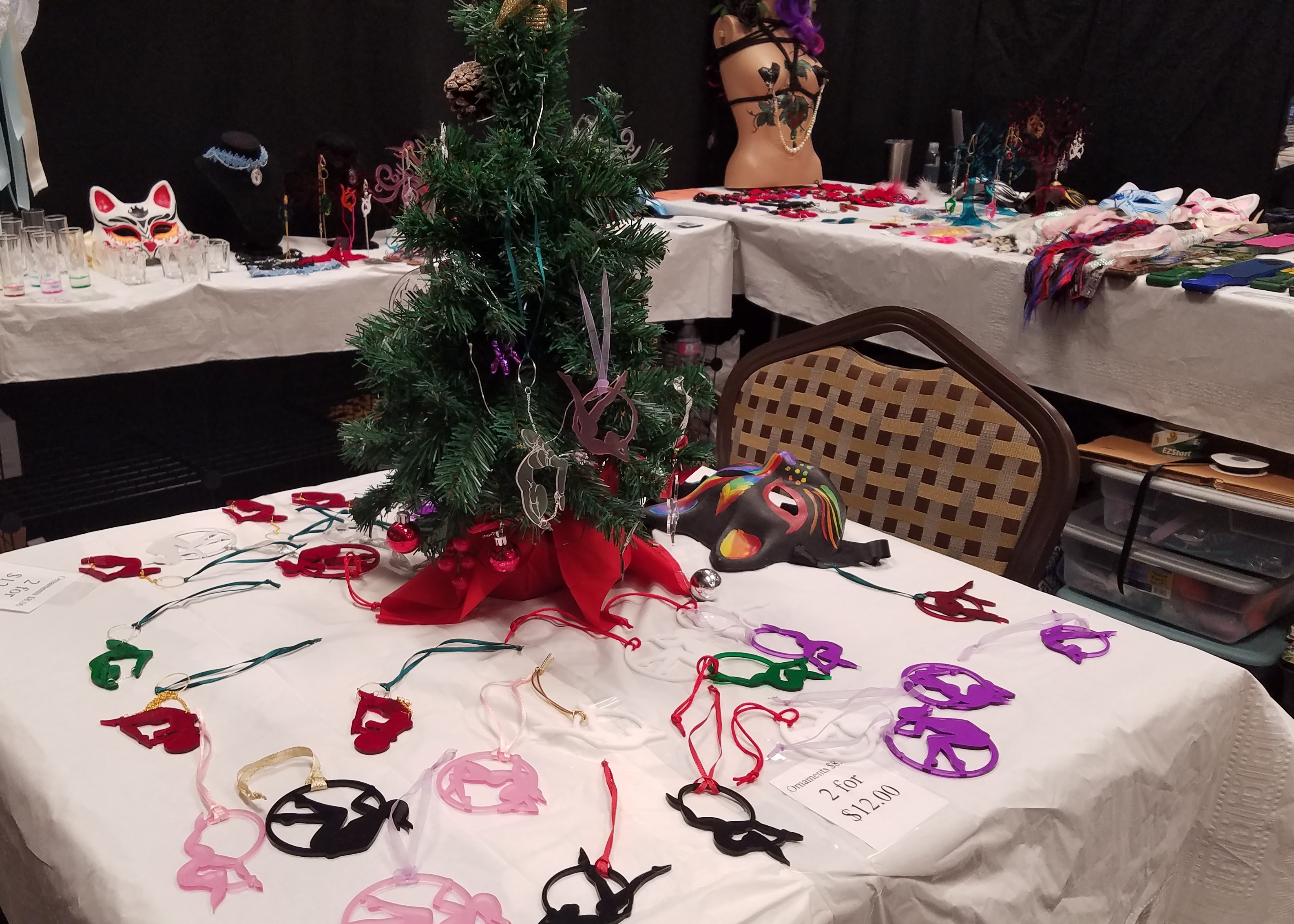 Picture of paddles, ornaments, nippleclamps ect. booth at Rochester Erotic Arts Festival.