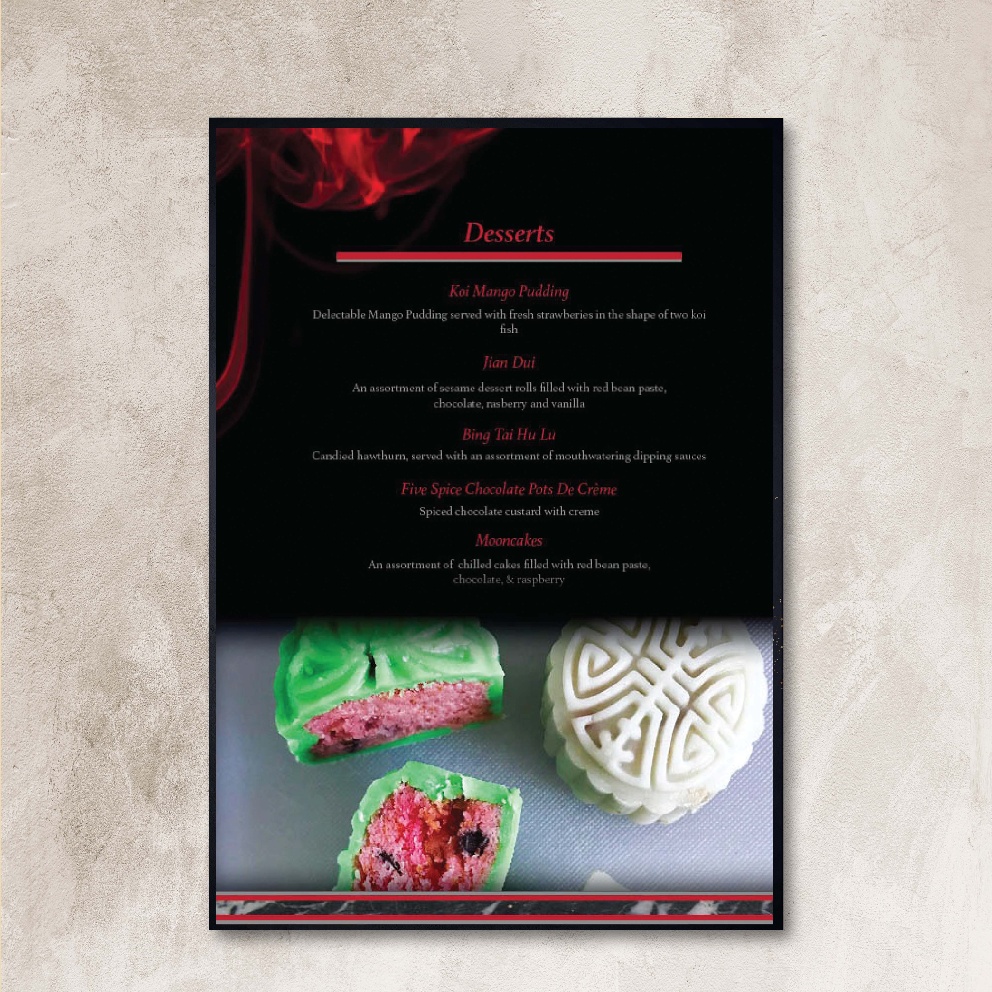 Back of a menu on a white marble table next to a knife, displaying the dessert menu with an image of a mooncake.